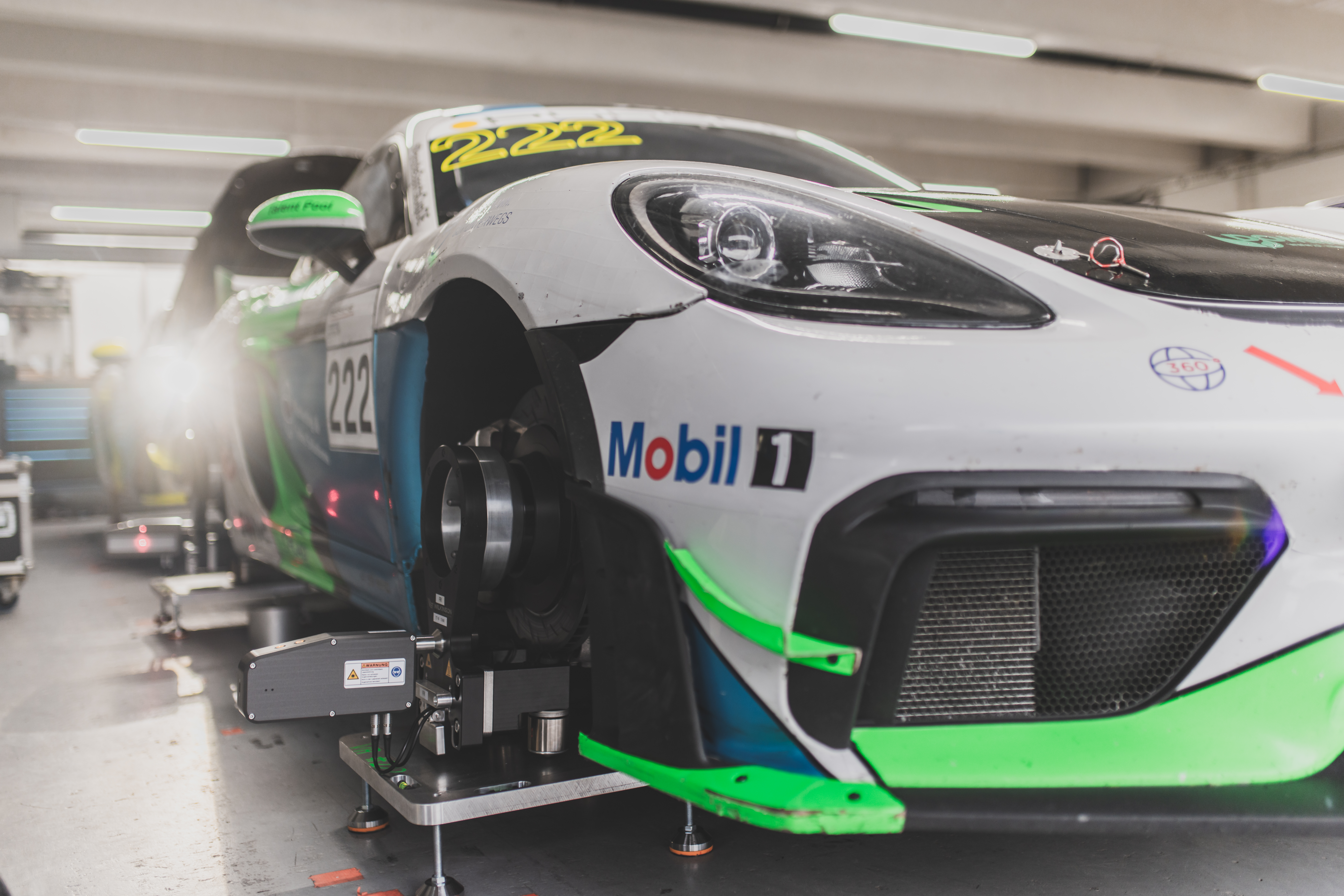 Trackside Aligner measurement heads mounted on a Porsche Cayman by EPS Motorsport