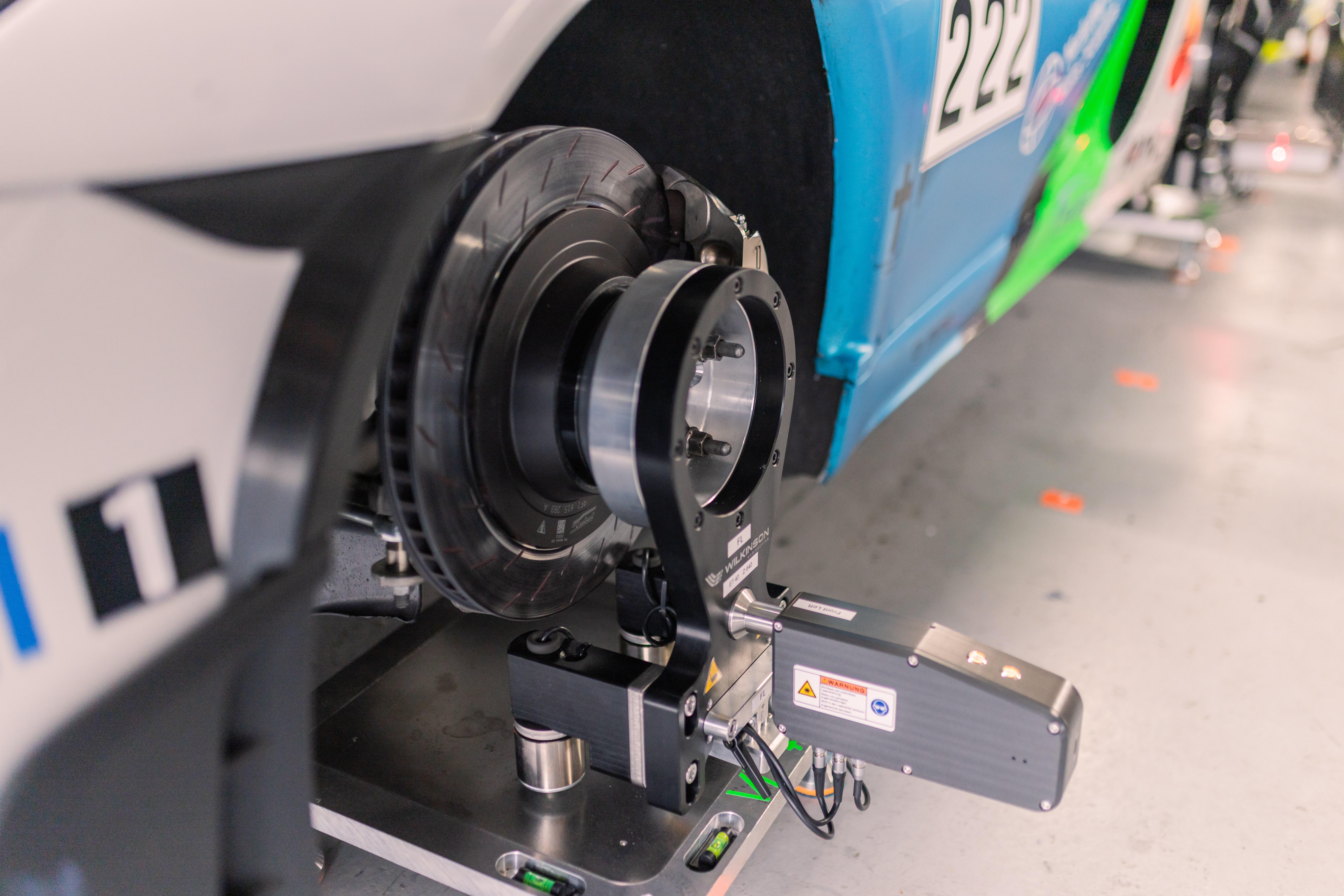 Close-up of Trackside Aligner measurement head from the rear on Porsche Cayman � EPS Motorsport